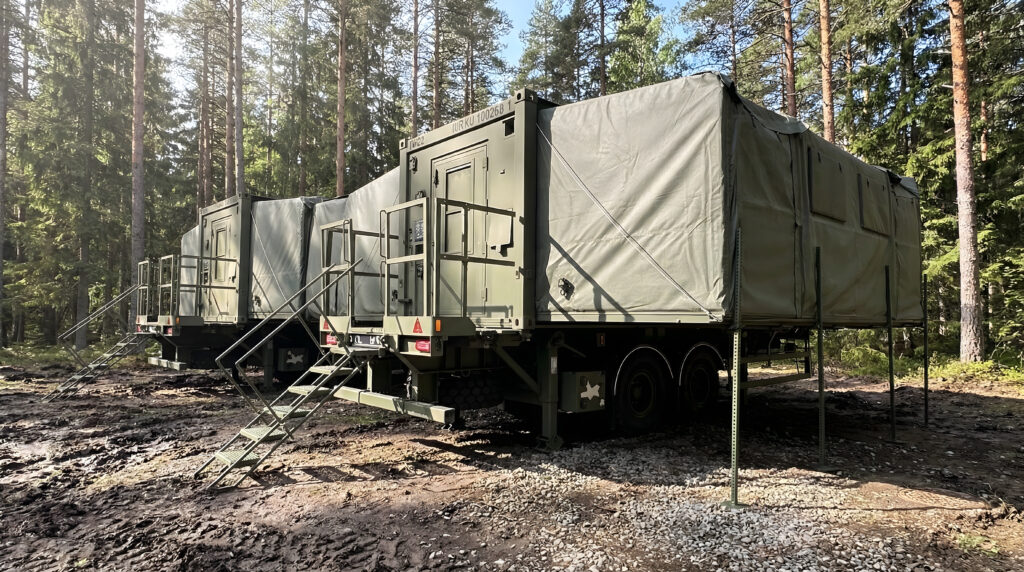 2 MECCs complexed in a forest on military exercise